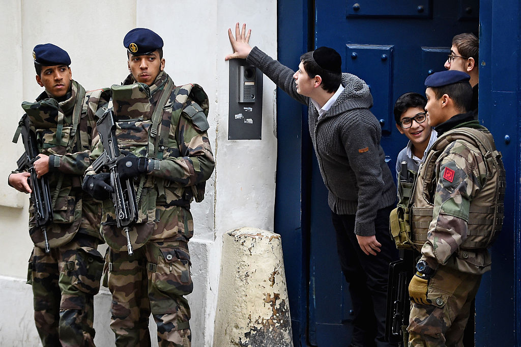 French soldiers quarding Jews on the streets